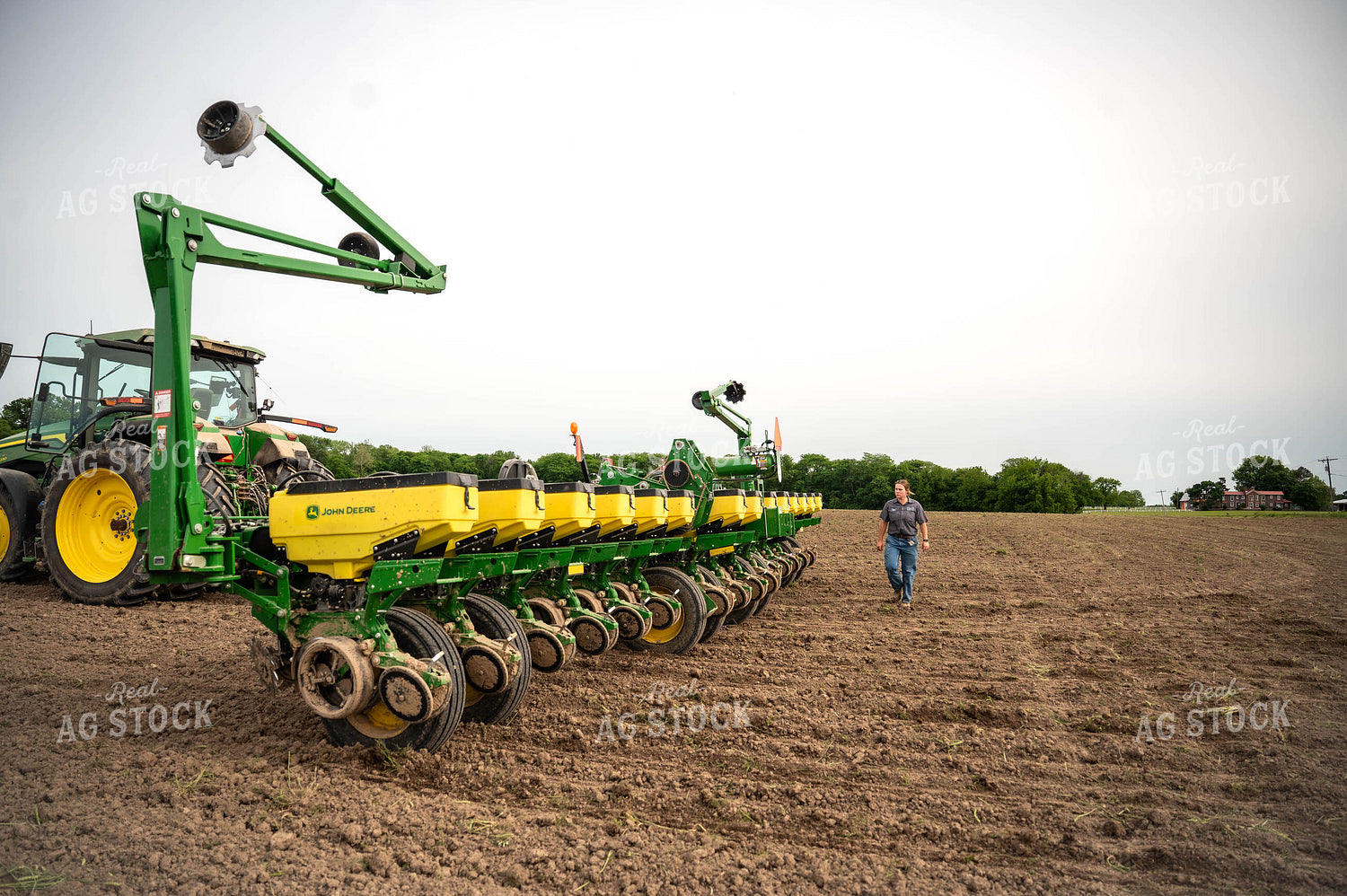 Female Farmer Walking by Planter 115656