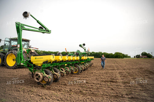 Female Farmer Walking by Planter 115656