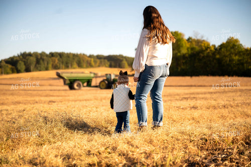 Farm Family Watching Combine 115425
