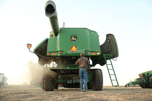 Farmer Blowing out Combine 114098