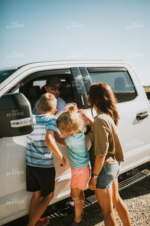 Farm Family Greeting Farmer in Pickup Truck 6164