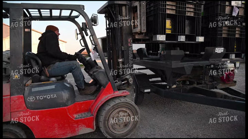 Loading the Seed Tender with a Skidsteer - 064