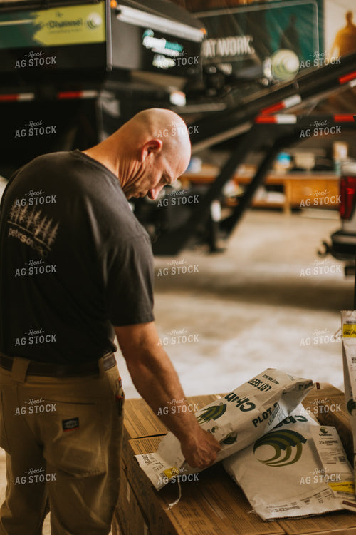 Farmers Looks at Seed Bags 7577