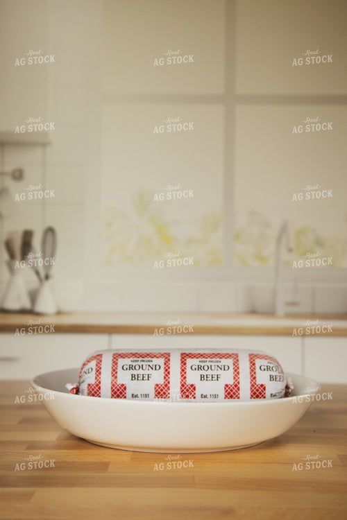 Raw Packaged Ground Beef in Bowl on Kitchen Countertop 67325