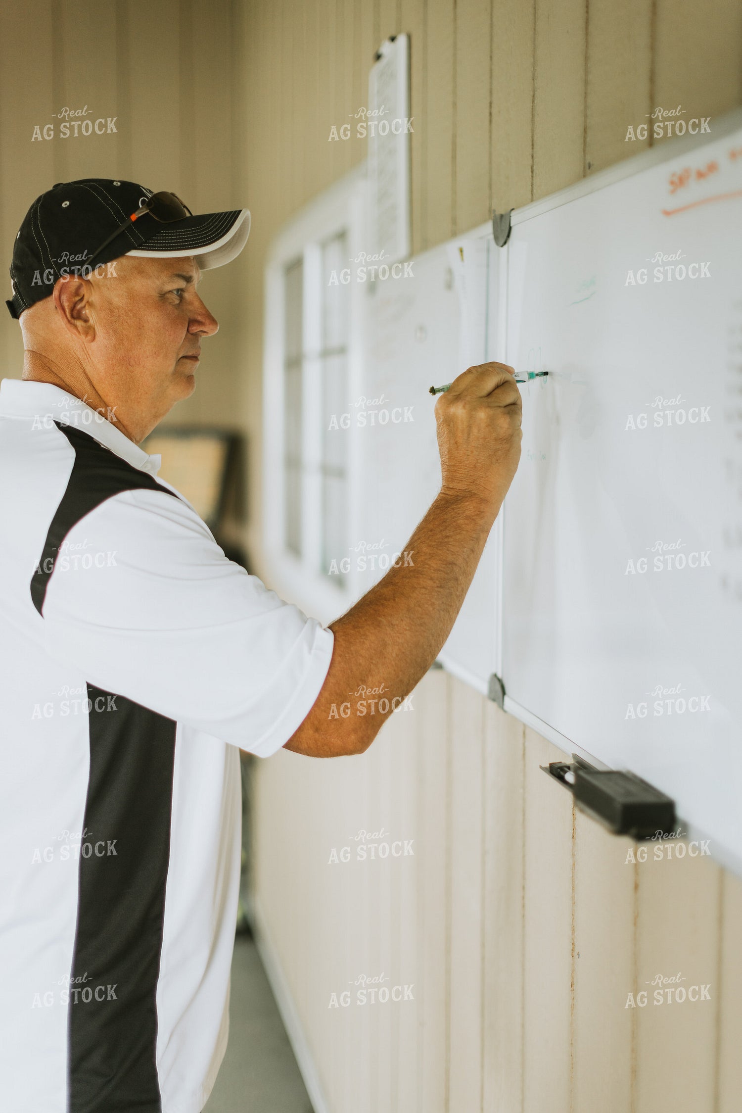 Farmer Writing on White Board 7754