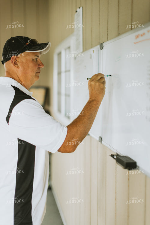 Farmer Writing on White Board 7754
