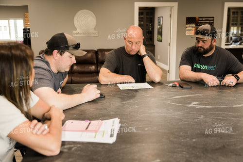 Farmers Review Seed Orders in Farm Office 7618
