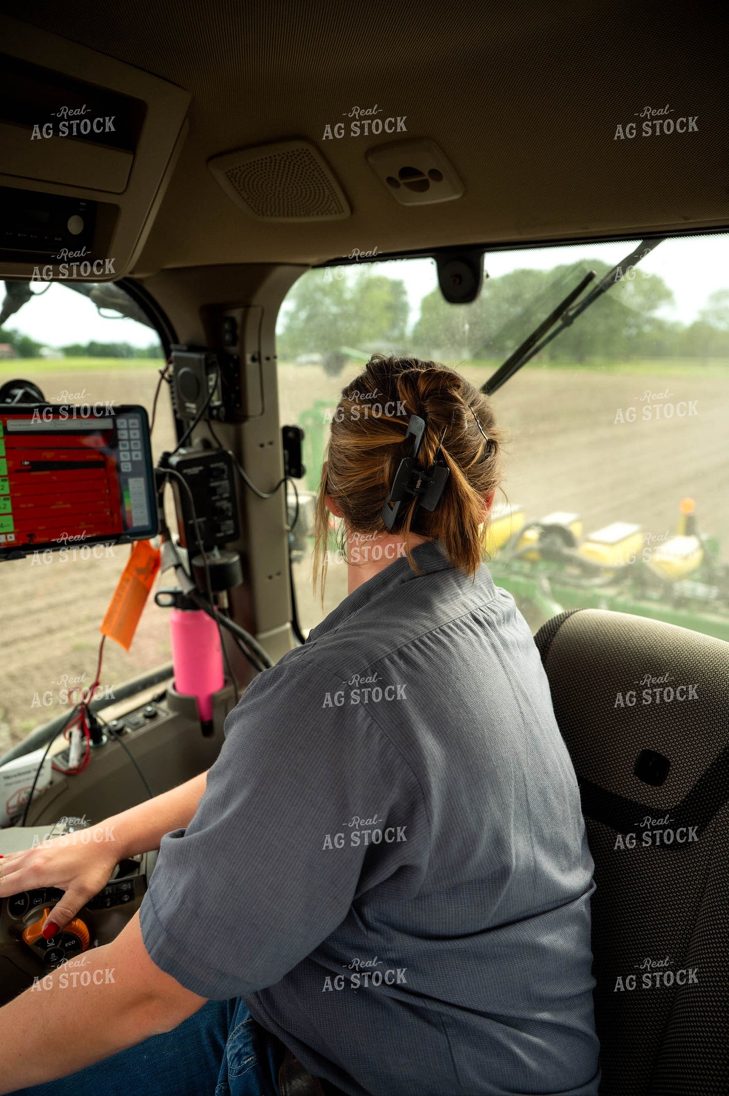 Female Farmer in Tractor Cab 115663
