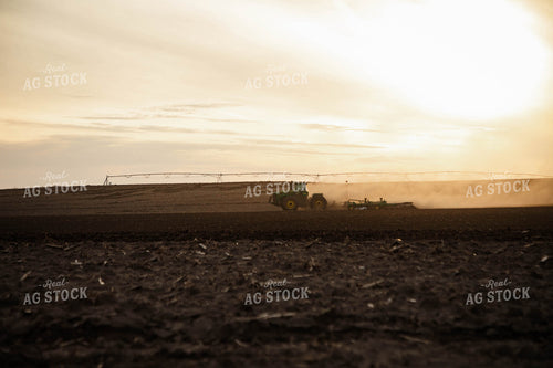 Large Tractor Plowing Field on a Dusty Spring Day 152477