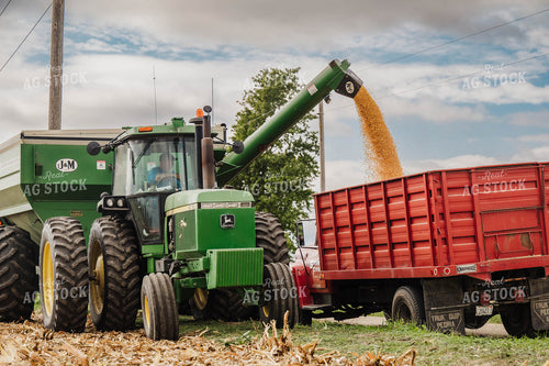 Auger Wagon Unloading Corn into Tandem Truck 115346