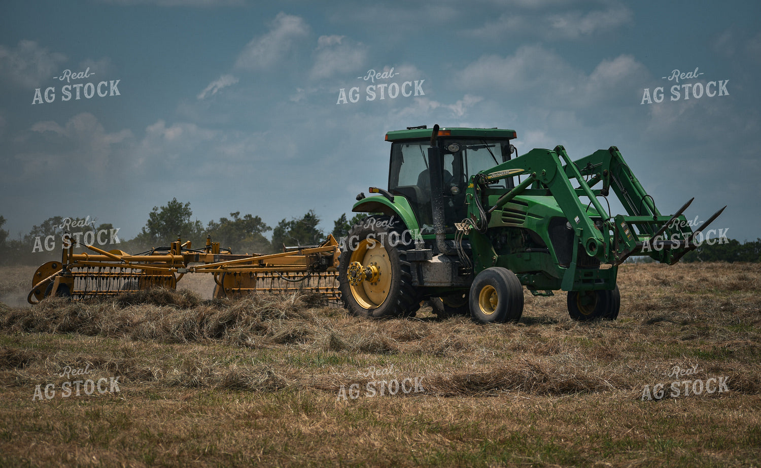 Front-End Loader Tractor Raking Hay 112016