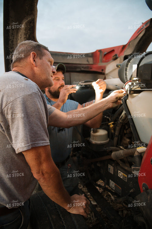 Farmers Fixing Semi Truck 26044