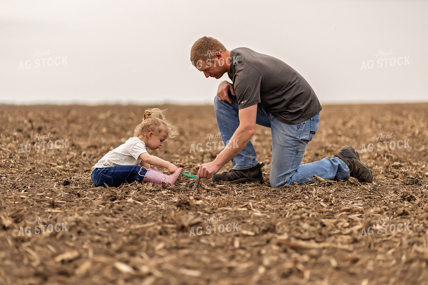 Farmer and Daughter Checking Soybeans 93291