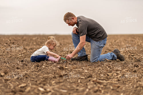 Farmer and Daughter Checking Soybeans 93291