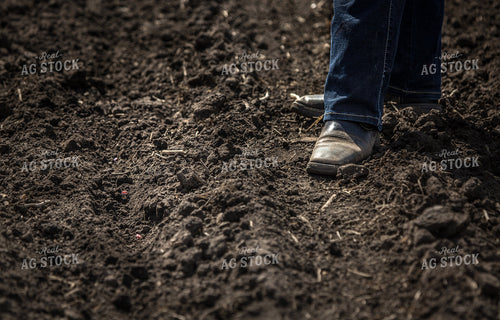 Farmer in Boots in Soil 161181