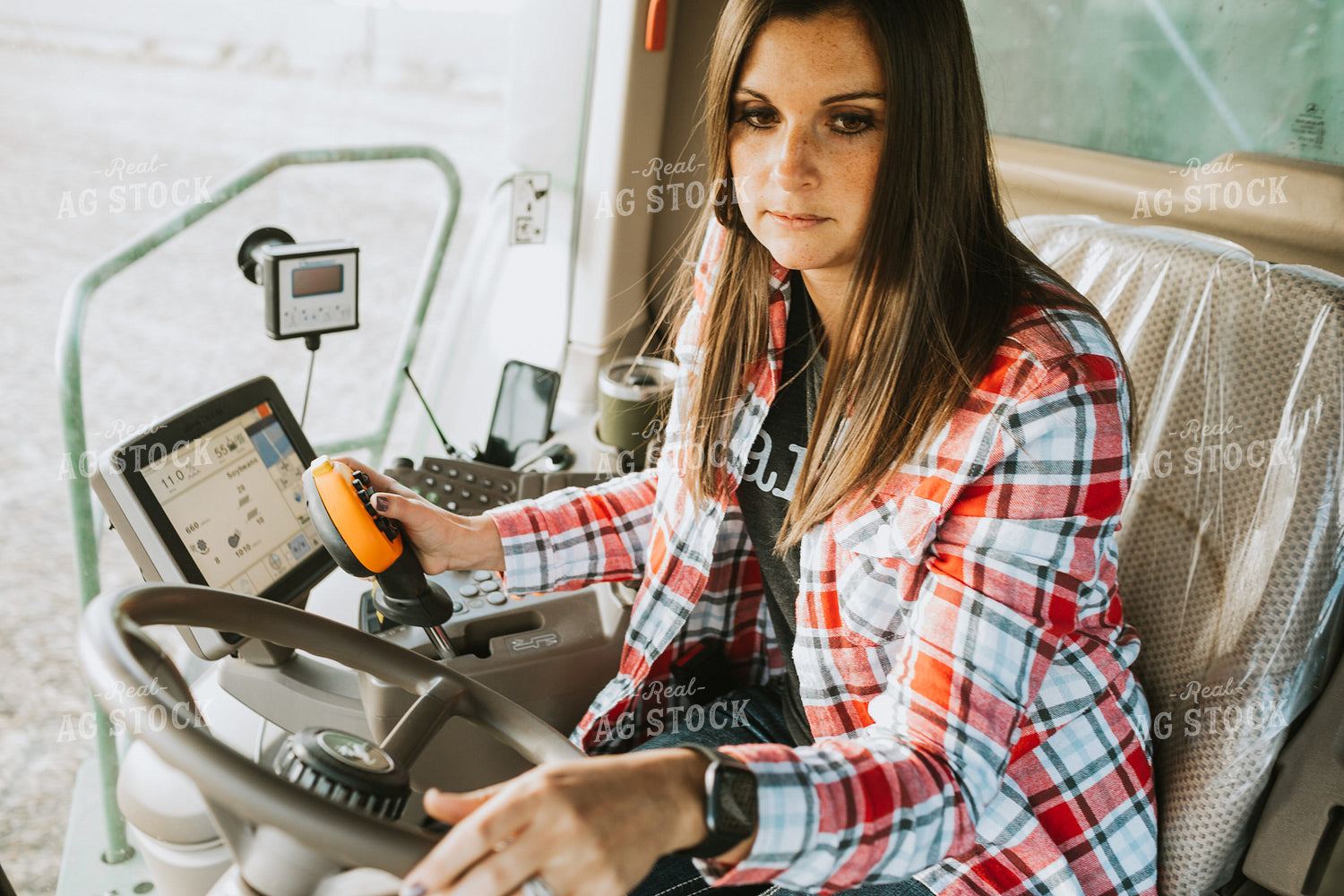Female Farmer Driving Combine 3490