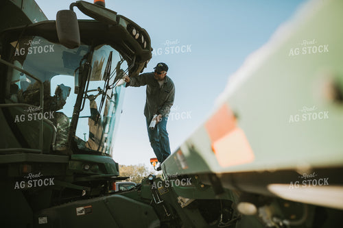 Farmer Cleaning Combine Windows 5224