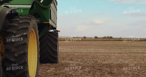 Female Farmer Climbing into Grain Cart Tractor 3968