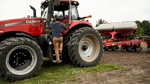 Farmer Climbing into Planter 25148