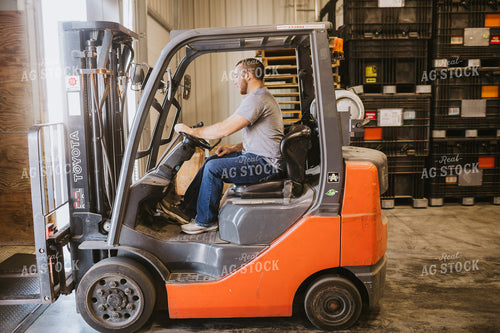 Forklift Operator Unloading Bulk Bins 5334