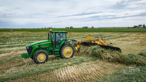 Tractor with Merger in Hay Field 56417