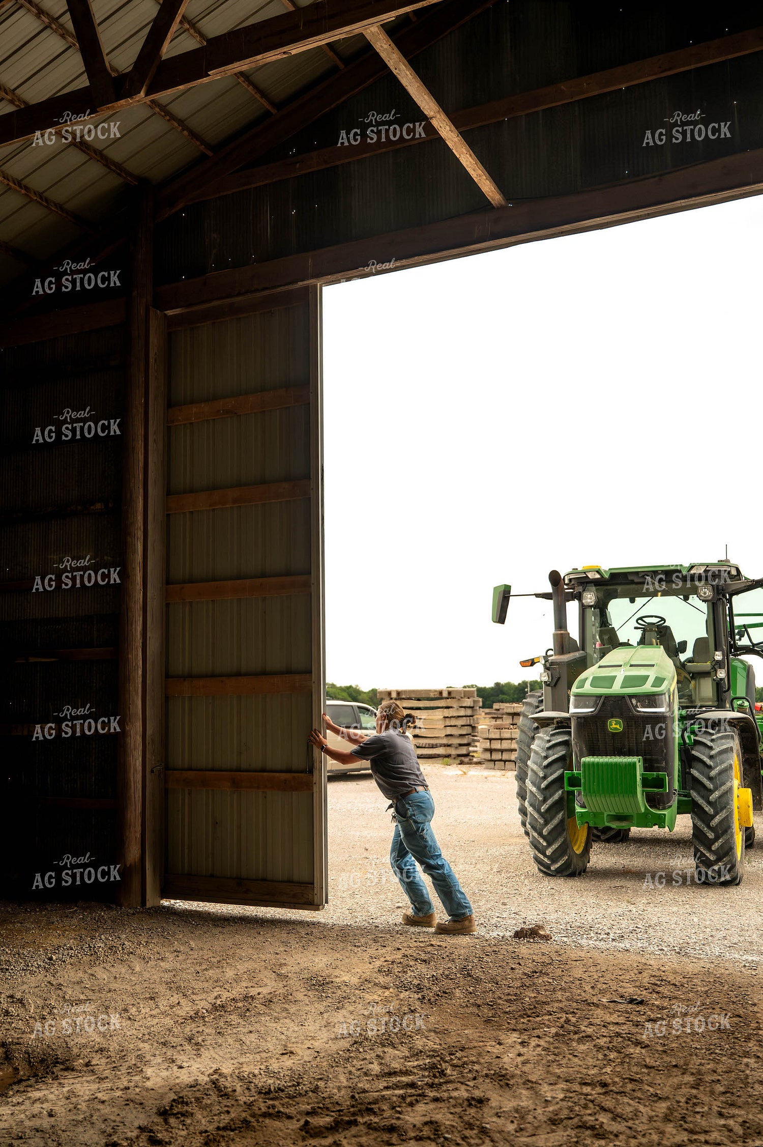 Female Farmer Opening Shed Doors 115712