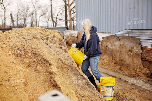 Female Farmer Working in Farmyard 127009