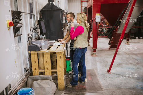 Man and Woman Running Seed Treater with Computer 5323