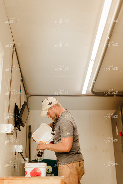 Farmer Checking Moisture of Stored Corn 9327