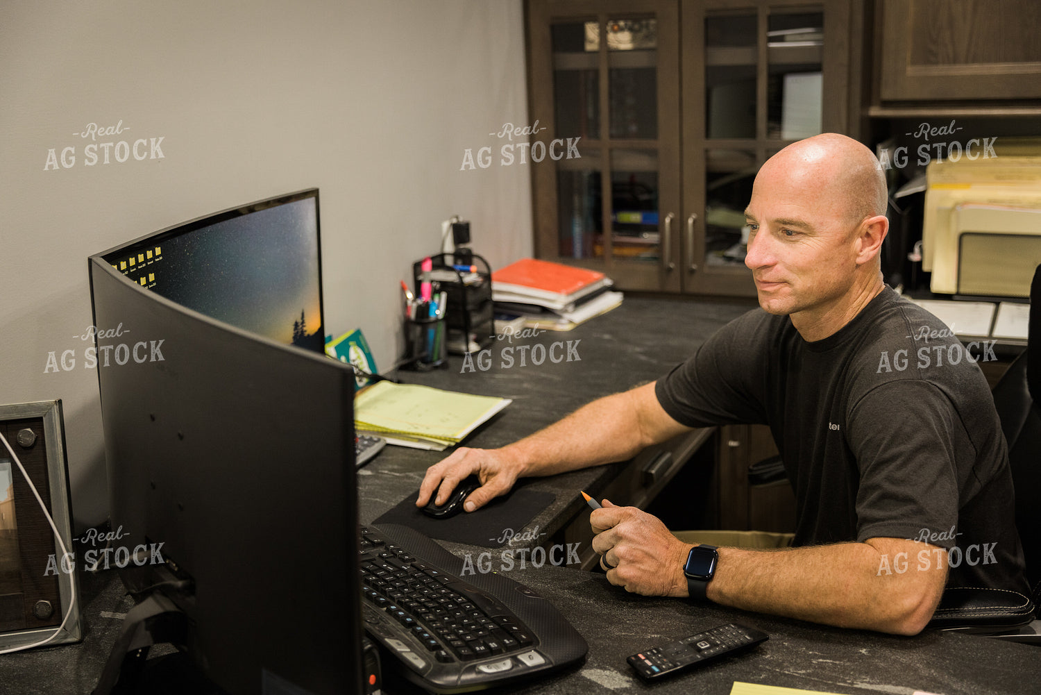 Farmer Works on Computer in Office 7493