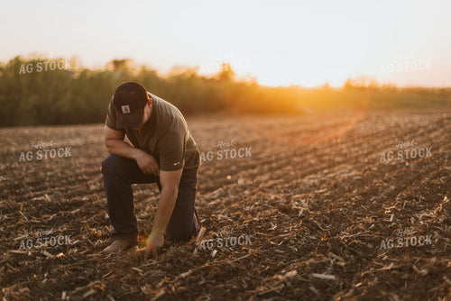 Farmer Checks Seed Depth After Planting 7715