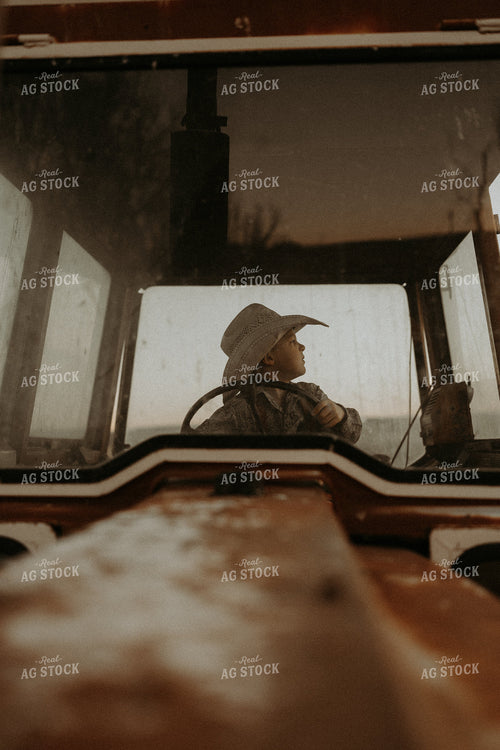 Farm Kid in Tractor Cab 61220