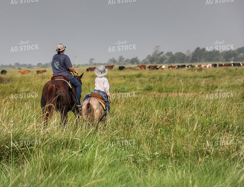 Rancher and Kid on Horseback 210005