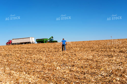 Farmer Walking to Combine in Field 154032