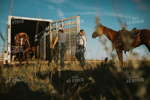 Ranchers in Pasture with Horse 6375