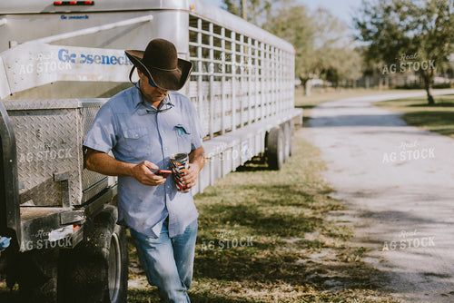 Rancher Looking at Phone 7316