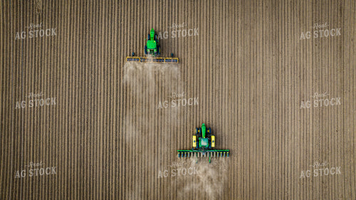 Aerial View of Tractor Rolling Field Ahead of Tractor Planting 56619