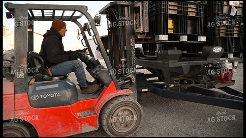 Farmer Loading the Seed Tender with a Skidsteer 25192