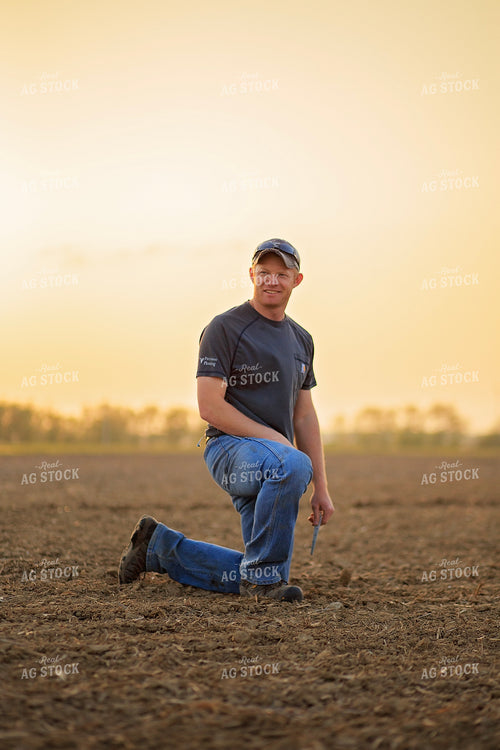 Farmer Checks Seed Depth After Planting 93201