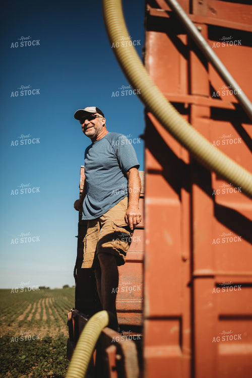 Farmer in Tandem Water Truck Filling Sprayer 4379
