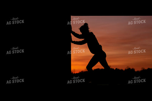 Female Farmer Opening Shed Door Silhouette 50018