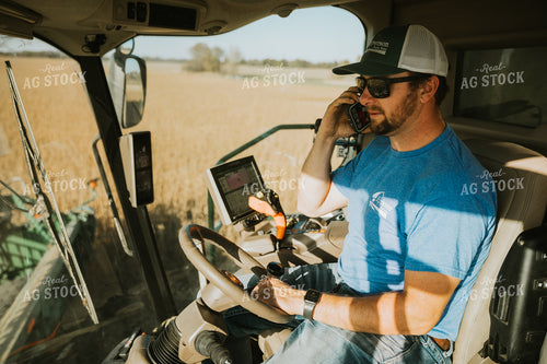 Farmer Operating Combine and Talking on Phone 7112