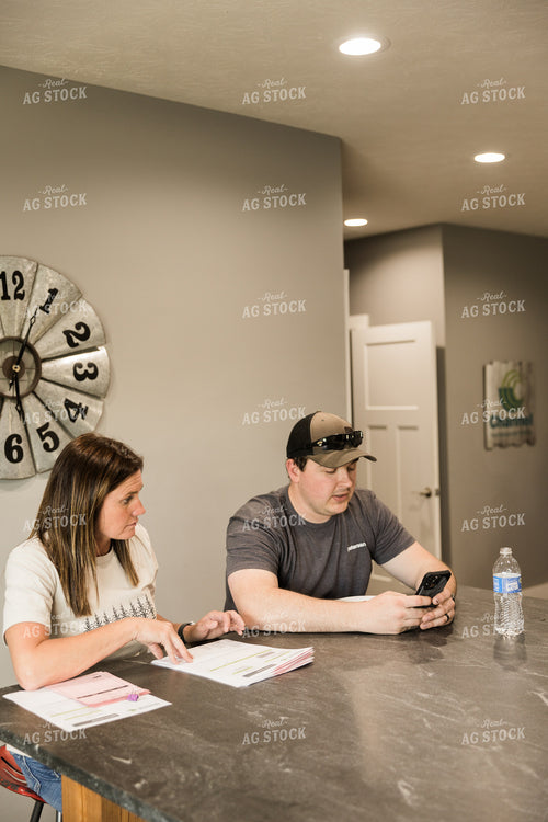 Farmers Review Seed Orders in Farm Office 7614