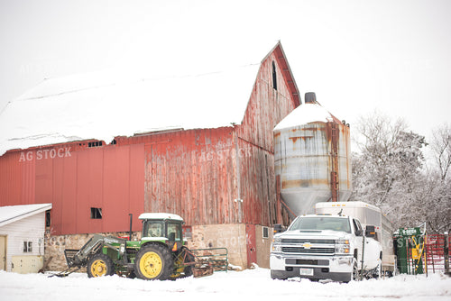 Red Barn with Farm Equipment in the Snow 74023