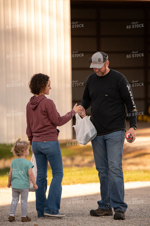Family Delivering Field Meal 76455