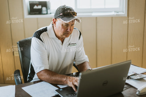 Farmer Working on Computer 7749