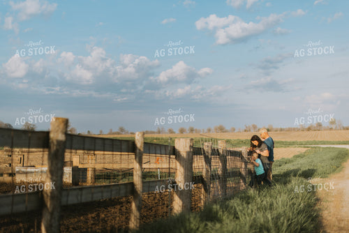 Farm Family Standing at Fence 7412