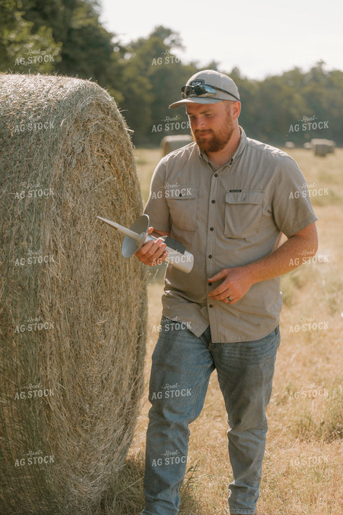 Farmer Checking Hay Moisture 125394