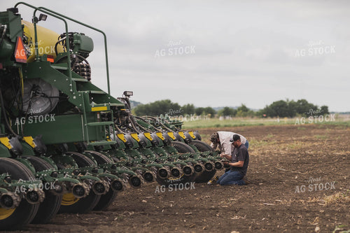 Planter in Field With Farmer 91005