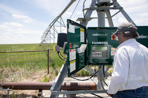 Farmer Checking Pivots 117055